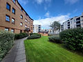 Apartment building exterior with landscaped lawn