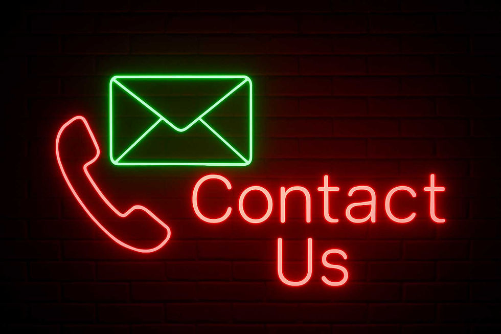 Neon sign with phone, envelope and Contact Us message in red and green.