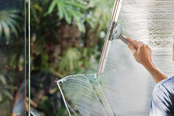 Window cleaning with a squeegee