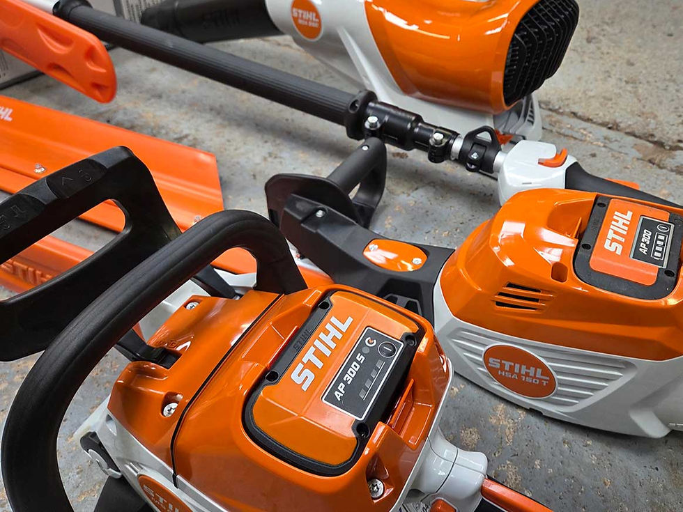 Fyvie Contracts grounds maintenance team ready to a battery-powered hedge trimmer at a commercial site in Scotland