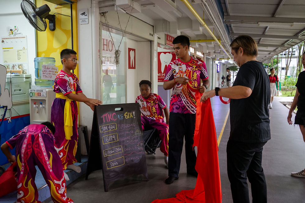 Rowshaun helping LDC Coach Delvin set up the red curtain during TTKC’s sixth birthday.