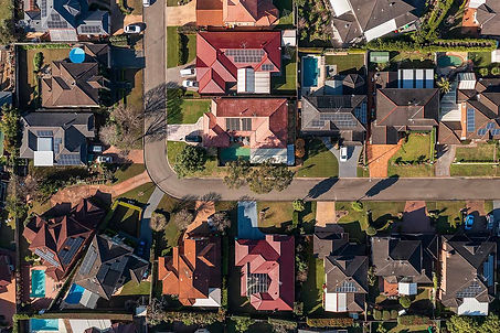 6580aebd011c53da837f6fa3_Rooftop solar aerial roofs small iStock-1407775051.jpg