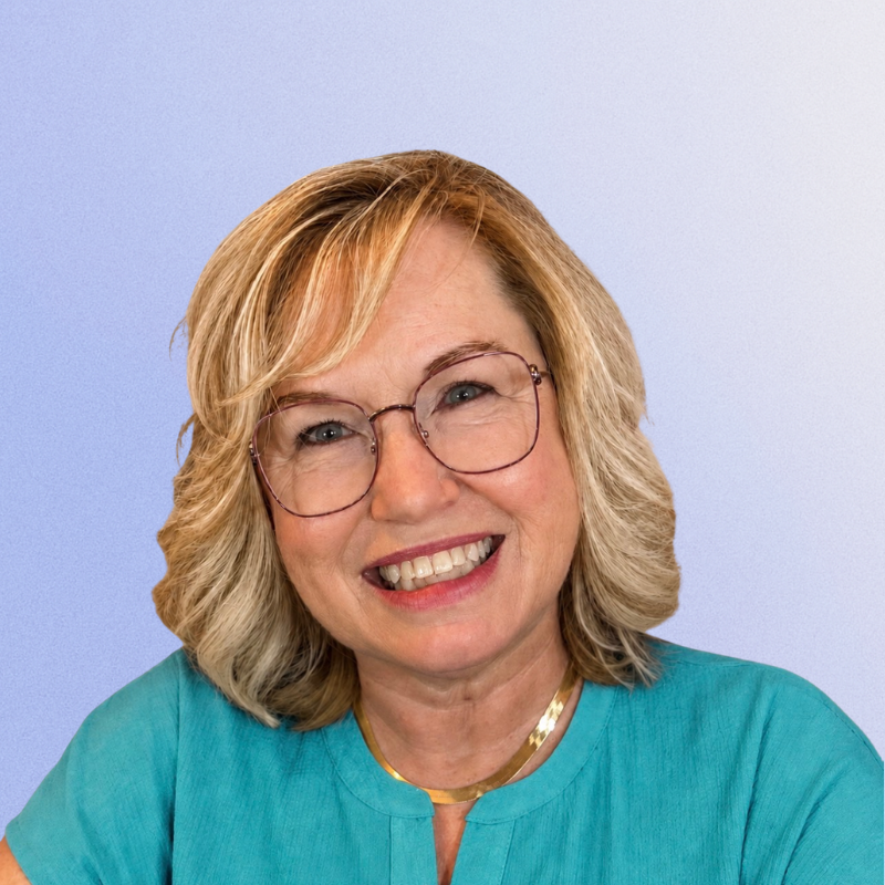 Smiling blonde woman with glasses in a turquoise shirt