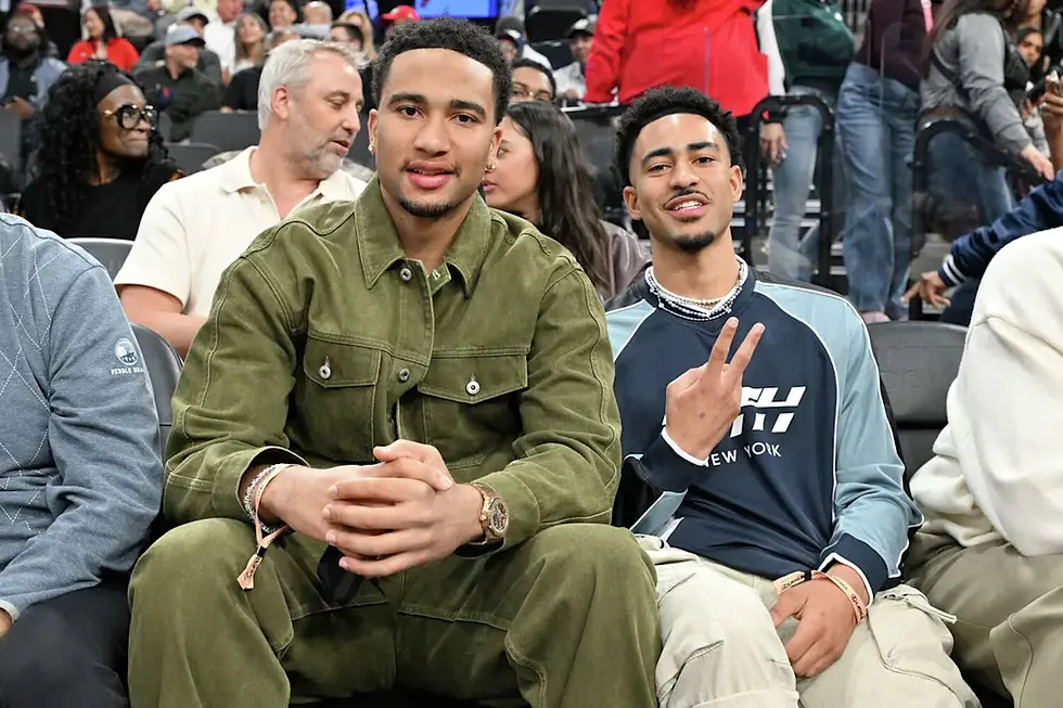 Bryce Young and CJ Stroud sitting courtside at the Los Angeles Clippers vs Minnesota Timberwolves game