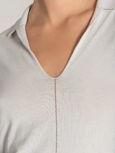 Sustainable open-neck polo styled for superyacht interior teams
