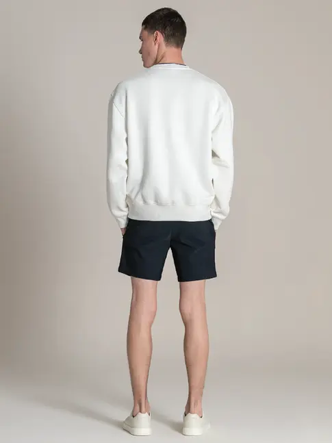 Men’s yacht uniform sweat paired with technical trousers for layering
