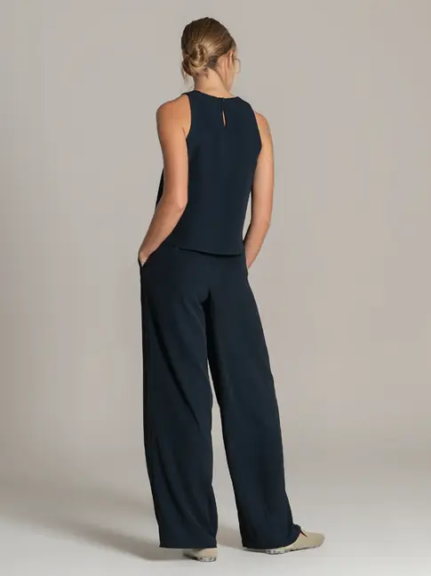 European made uniform top with clean neckline and fluid drape

