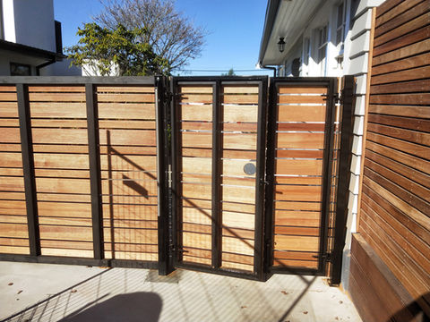 side gate and fence with timber attached to steel frame by Designer Gates in Chch