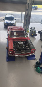 Classic red Ford Mustang in workshop – European car servicing Marlborough and Nelson NZ