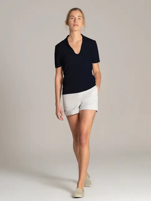Women’s polo shirt paired with tailored shorts for onboard service

