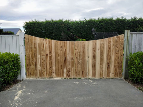 Timber driveway gates on a steel frame installed by Designer Gates in Chch