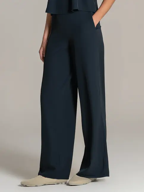 Elegant wide-leg trousers styled for superyacht interior service