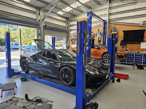 Black Ferrari on hoist – European supercar mechanic Marlborough and Nelson NZ