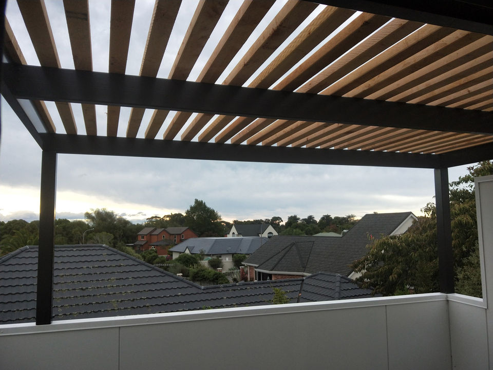 Steel Pergola powder coated Black with timber battens installed by Designer Gates North Canterbury
