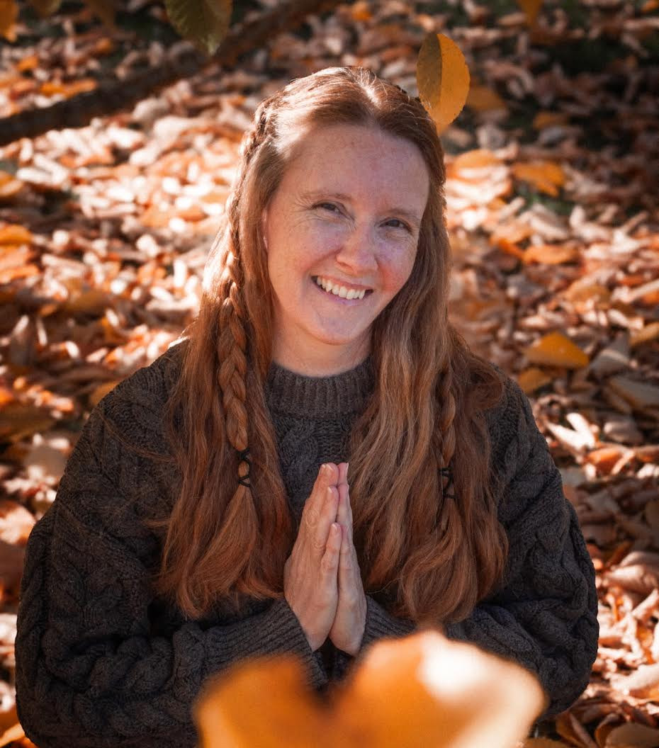 Woman in prayer pose at our stunning boutique yoga studio.