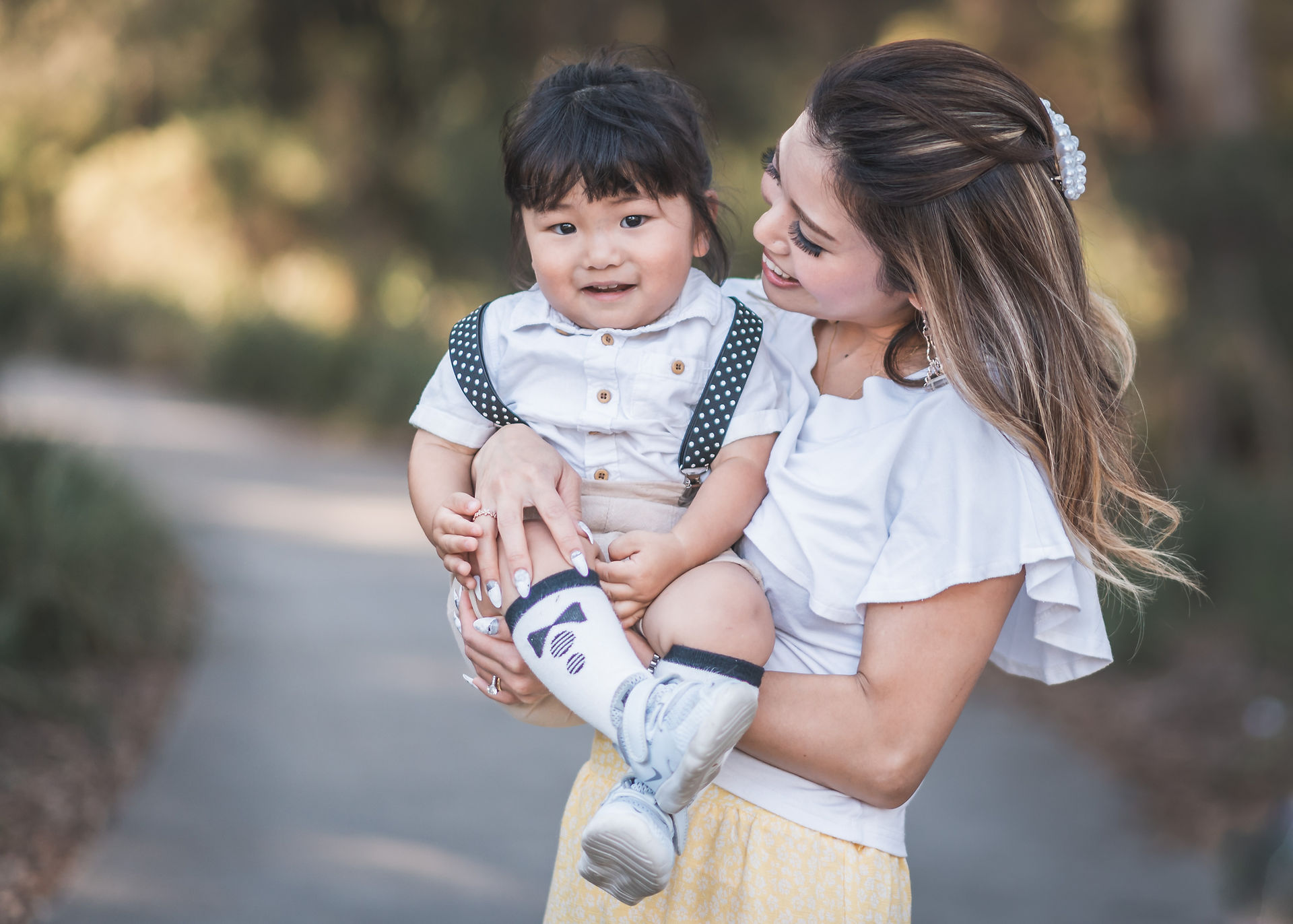 Lifestyle family photography - mother holding son