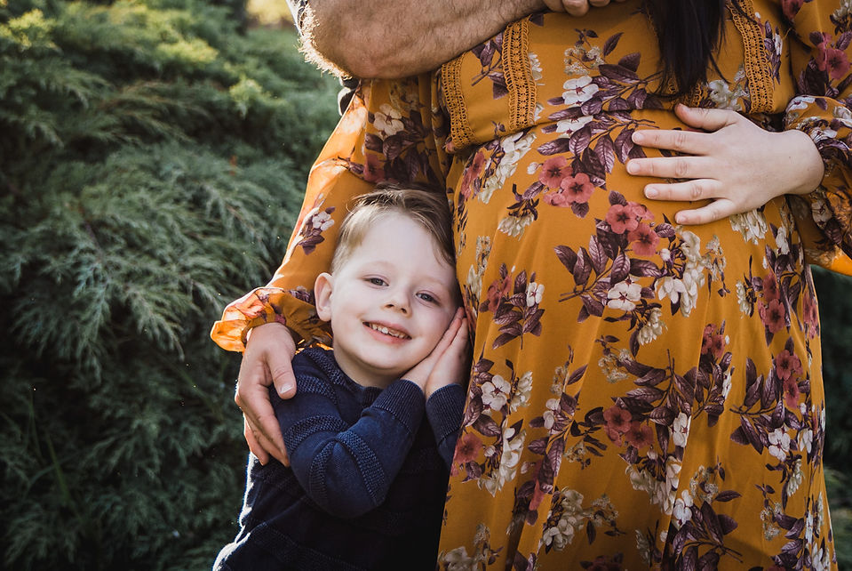 maternity lifestyle photoshoot melbourne - boy leaning against mothers pregnant belly