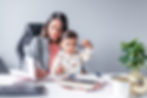 personal brand photo of a melbourne based virtual assistant with her toddler son sitting at her desk with her