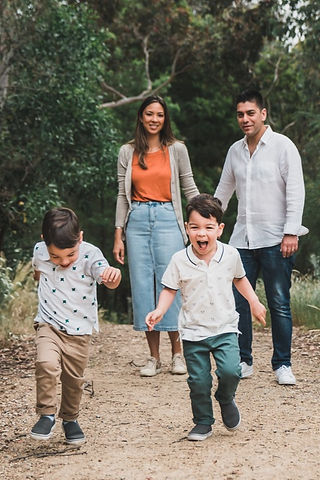 lifestyle family photography boys running in front of parents. Melbourne Camberwell 