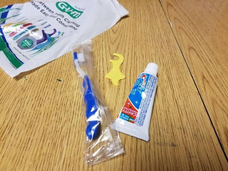 Toothbrush, floss, and toothpaste