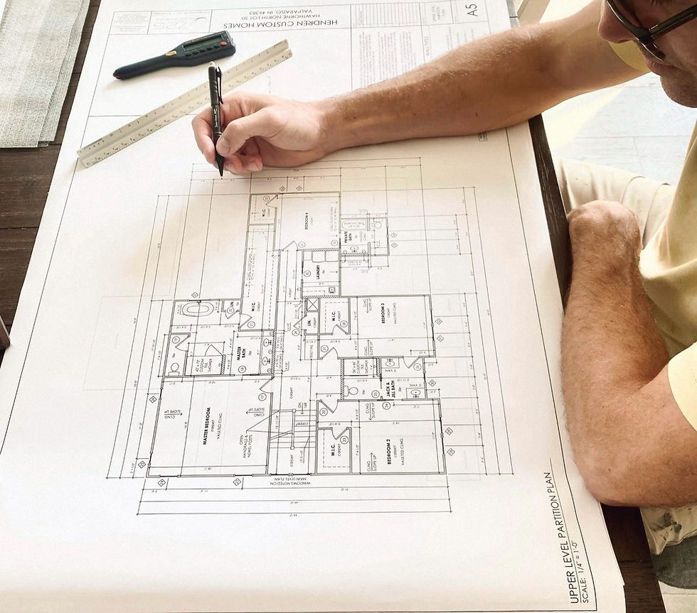 Mike Hendren drafting new construction plans.