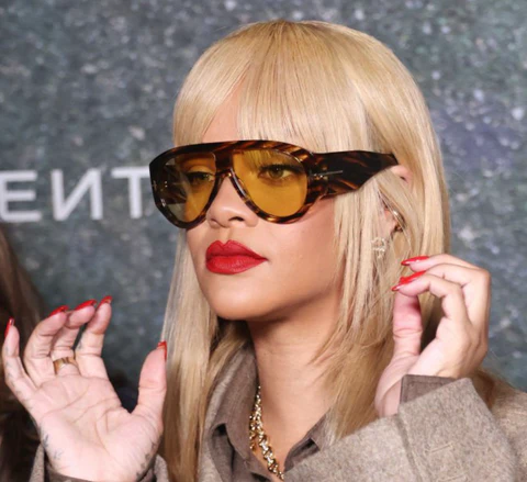 Rhianna wearing aviators