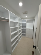 Custom closet shelving system with drawers and hanging space