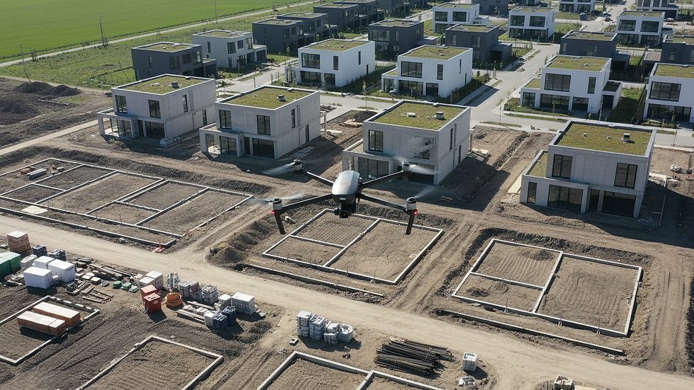 Eye-level view of a drone hovering over a land development site