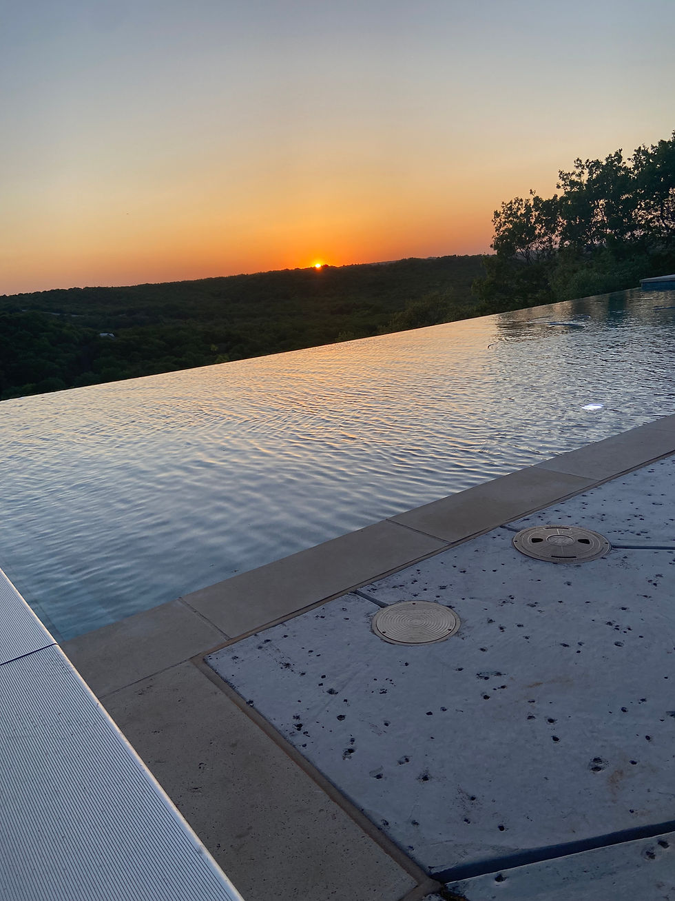 Infinity edge pool overlooking sunset