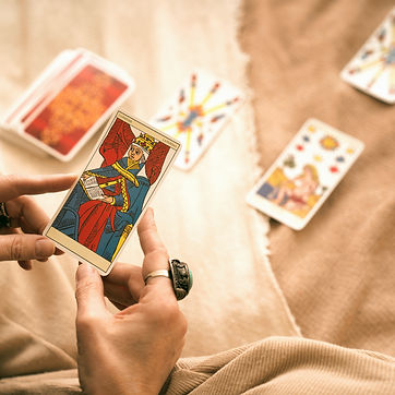 high-angle-woman-reading-tarot (2)_edited.jpg
