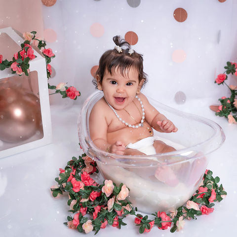 Baby girl in a milk bath