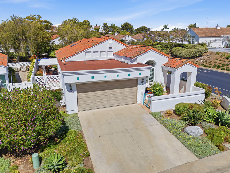 Aerial view of a house with red-tiled roof of Ocean Hills Country Club home in Oceanside, California.