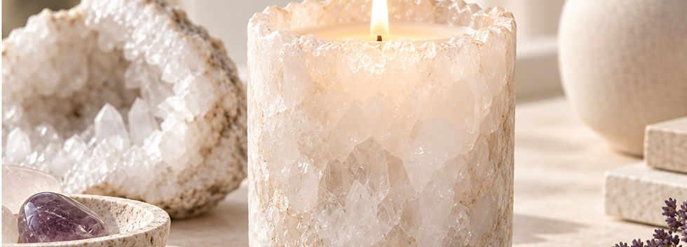 White crystal candle burning in a soft neutral wellness setting