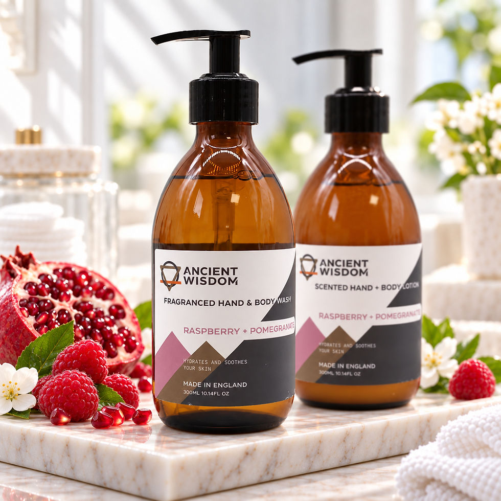 Close-up of Ancient Wisdom Raspberry and Pomegranate hand and body wash with matching lotion behind, with raspberries
