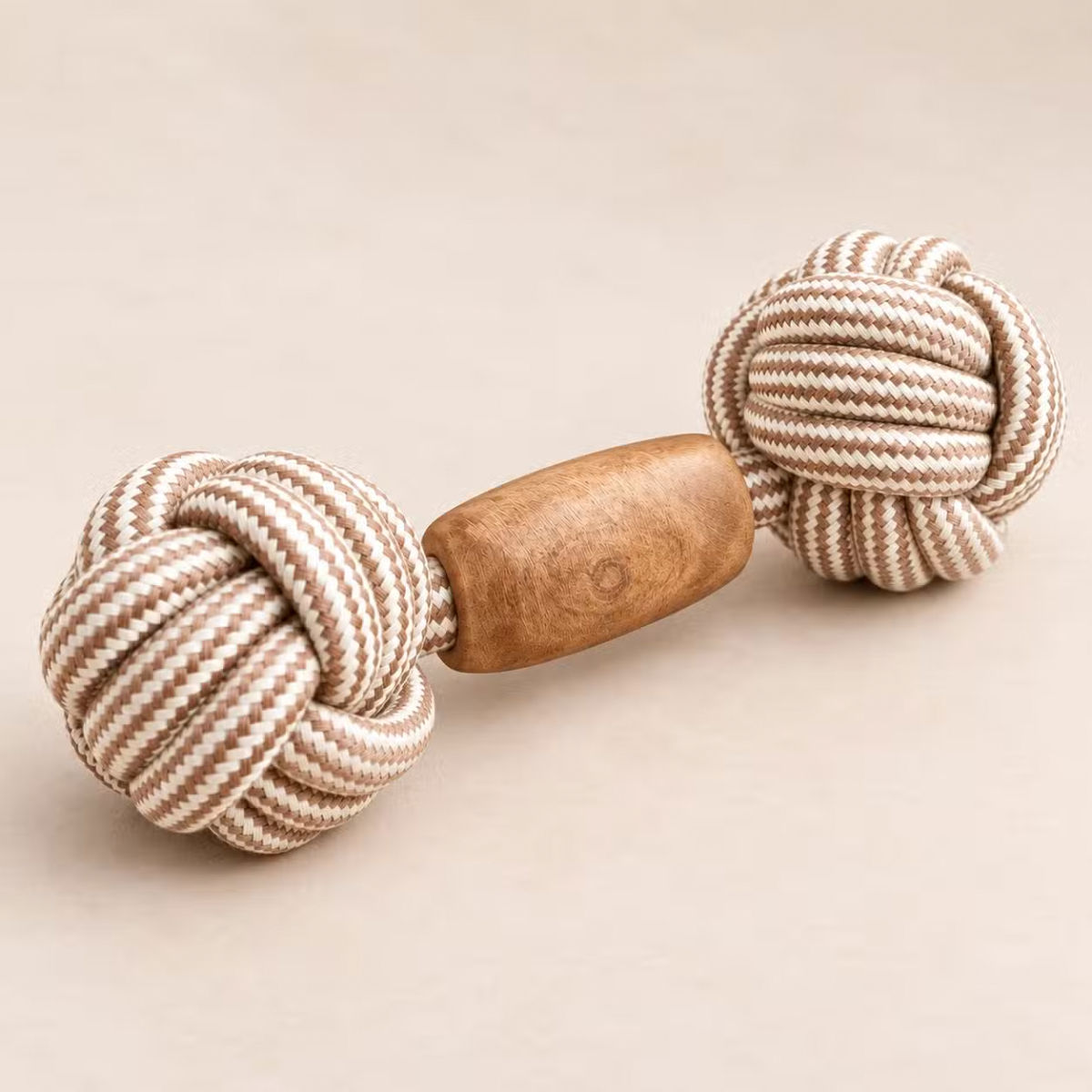 Double Trouble coffee wood and cream-brown rope dog toy with a knotted ball at each end on a neutral background.
