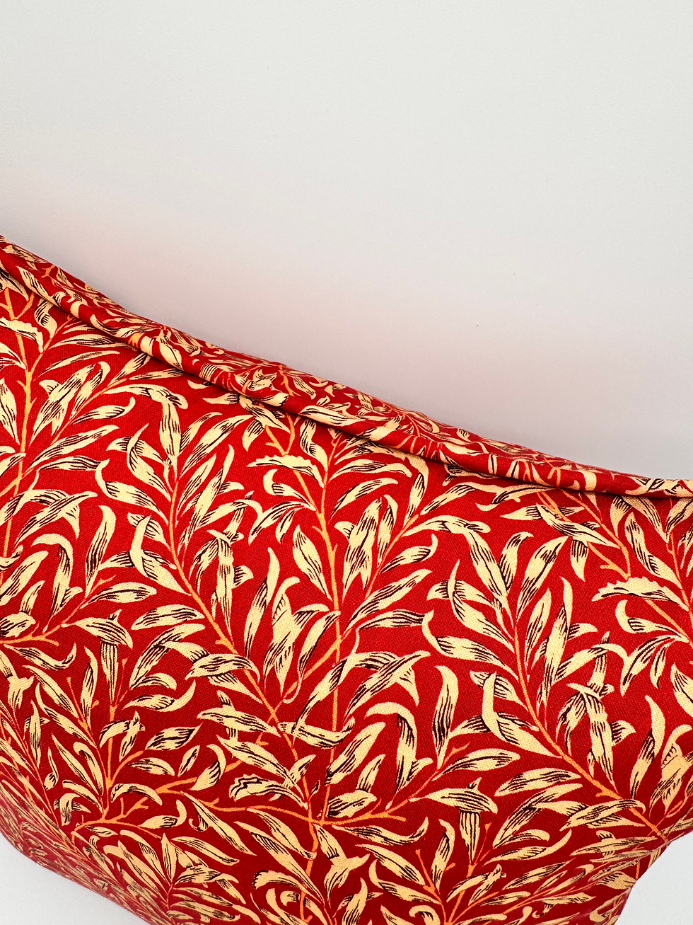 Thumbnail: close up of william morris bough crimson throw cushion with piped trim