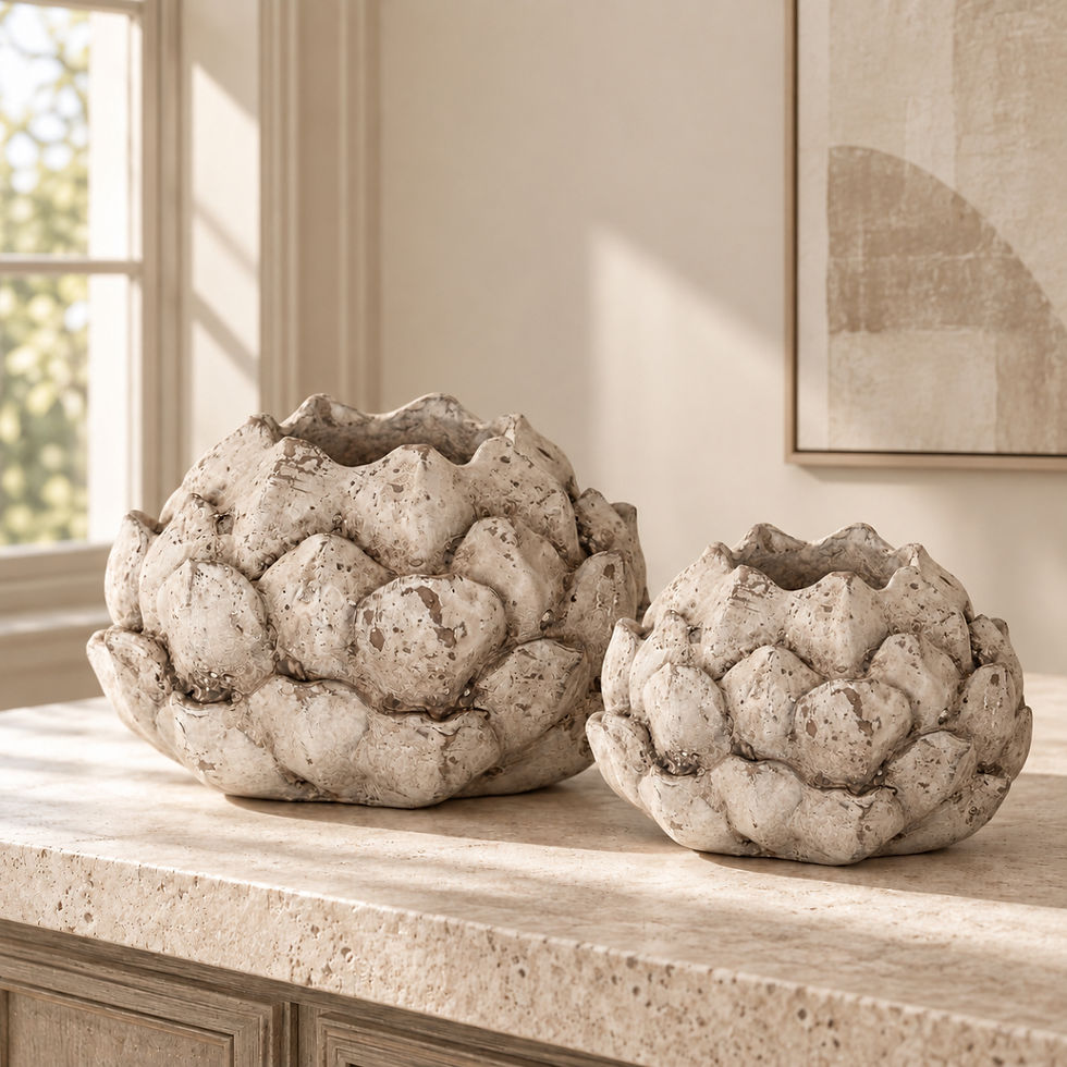 Two stone effect artichoke ornaments in small and large sizes styled together in a neutral heritage interior