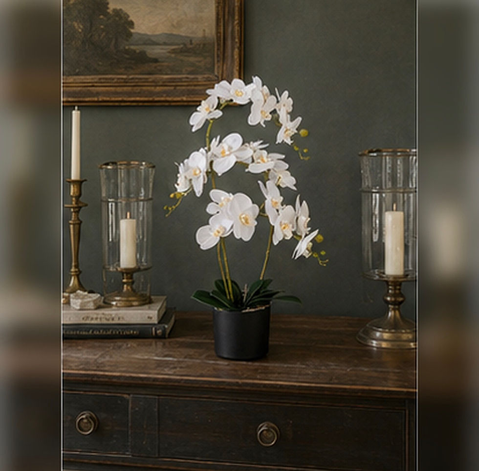 Thumbnail: Artificial white orchid displayed in a decorative indoor planter