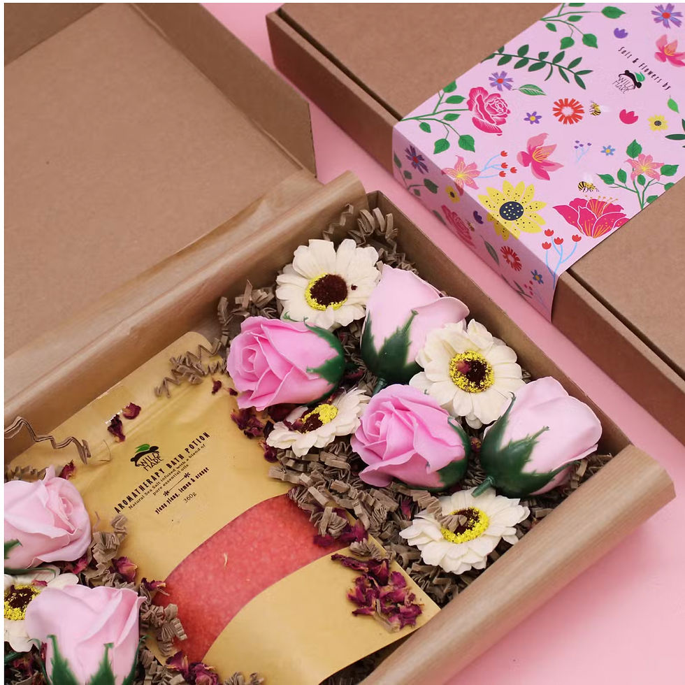 Citrus Blossom Guest Gift Set styled on fluffy white hotel towels in a bright guest room, featuring Wild Hare aromatherapy