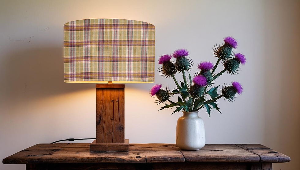 Thumbnail: balmoral highland wool olivine table lampshade on a wooden base with purple Scottish Thistles in vase