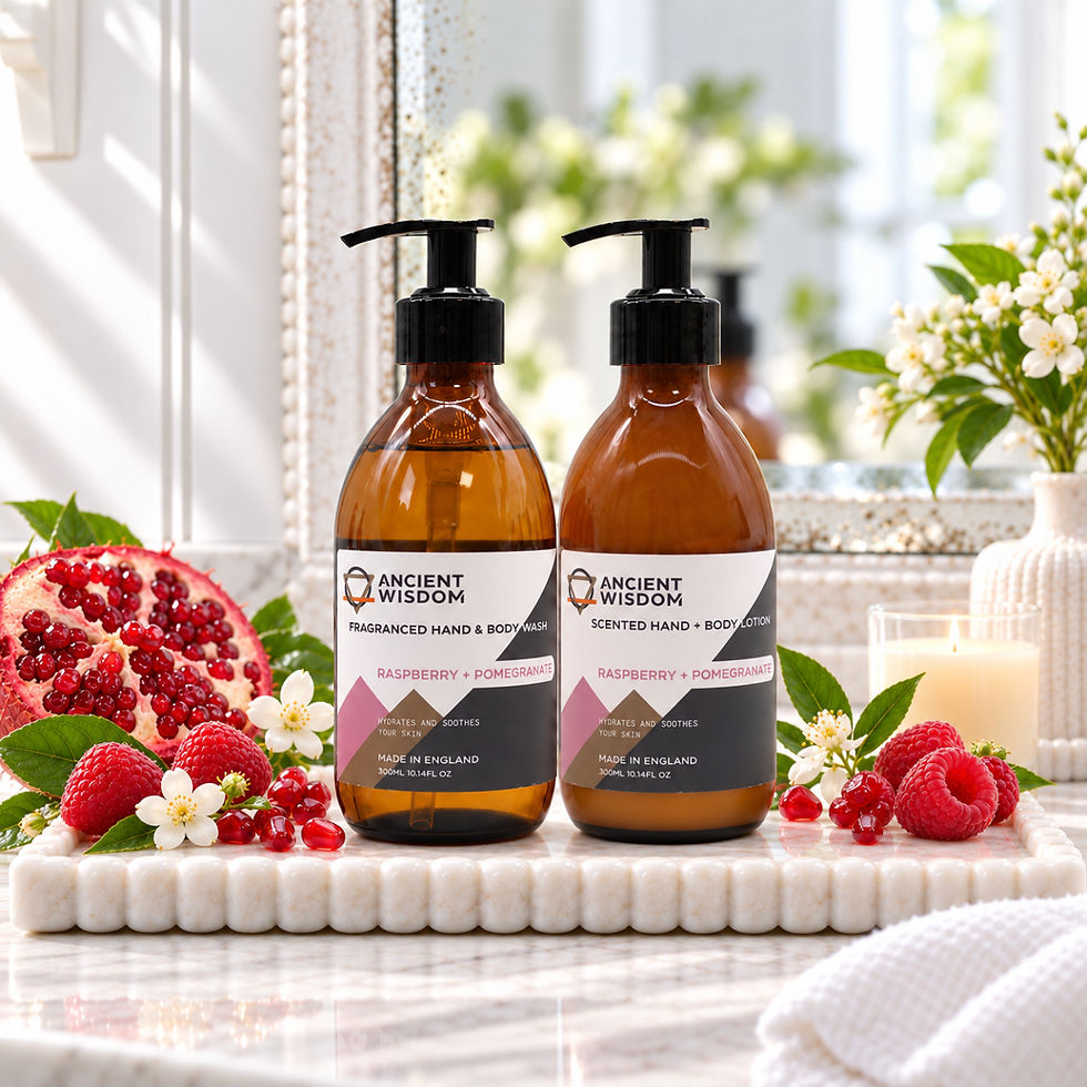 Raspberry and Pomegranate hand and body wash and lotion styled with pomegranate, raspberries, marble accessories and an ivory