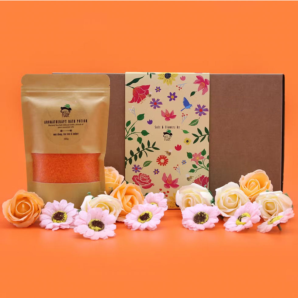 Botanical Retreat Guest Gift Set with floral bath salts, gift box and handwritten note styled on fluffy white hotel towels