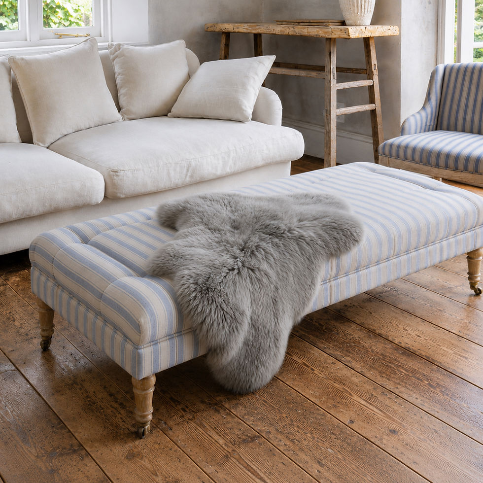 Vole natural wool fleece with muted brown-grey colouring over an ottoman