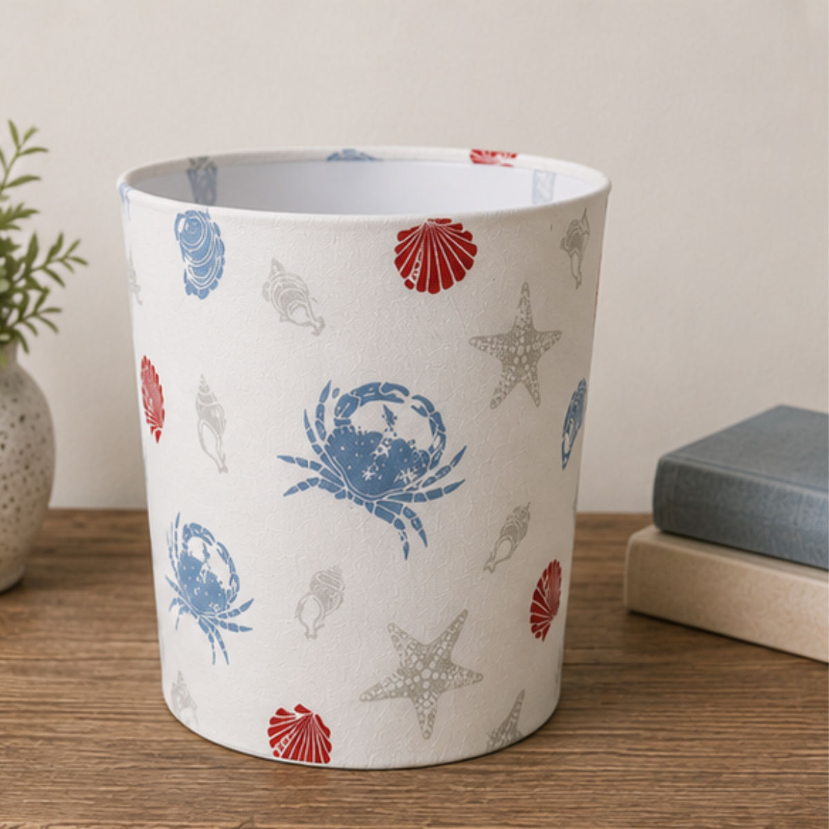 Handmade Offshore waste paper bin featuring shell, starfish and crab print fabric with white lining for coastal interiors