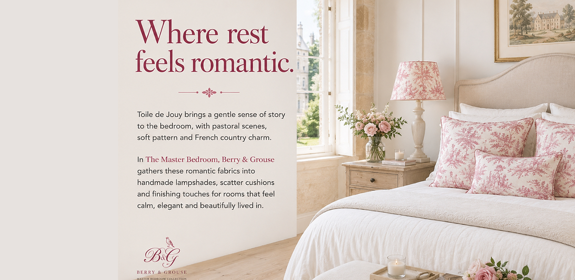 Berry & Grouse Master Bedroom with pink Toile de Jouy cushions and lampshade styled in a light country house bedroom with natural stone, oak flooring and soft morning light.