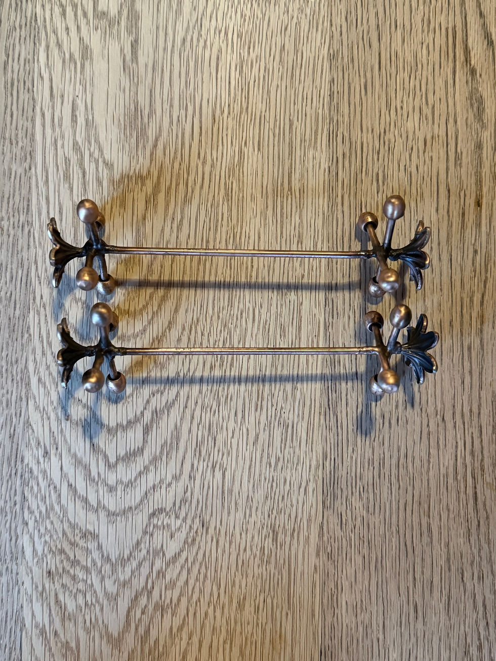 Thumbnail: Brass finish cutlery holder holding cutlery on a dining table.