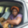 i need a compelling photo of a homeless Black woman living in her car.jpg