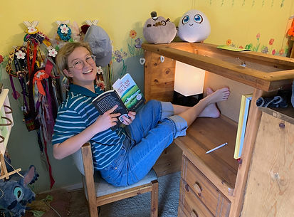 Outlaw reader kid at desk.jpg