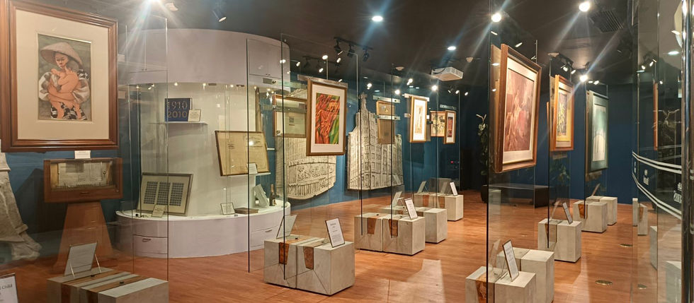 Art gallery at Grass Residences with framed paintings.