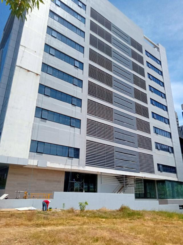 Modern facade of a Grass Residences building tower.